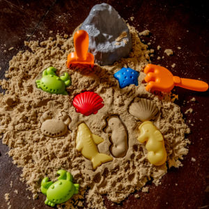 Sand and toys on table 